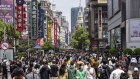 Chinese flock to Nanjing Road shopping district in Shanghai. Consumer prices have edged up. 