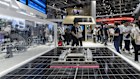 Solar panel technology on display at the Trina Solar Ltd. booth at the International Photovoltaic Power Generation and Smart Energy Expo in Shanghai.