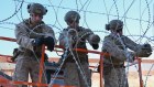 US marines install concertina wire along the US-Mexico border wall between San Diego and Tijuana on February 5.