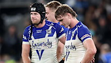Bulldogs players react during a loss to Penrith.