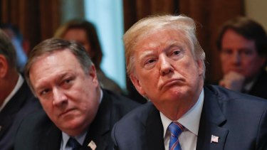 President Donald Trump, right, and Secretary of State Mike Pompeo are at odds over the alleged Russia hack.