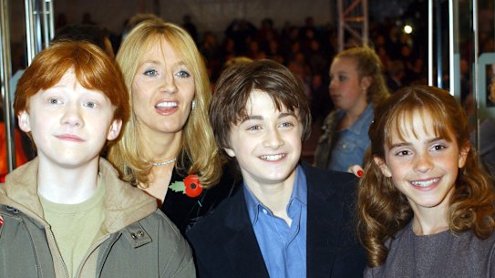 The stars from left to right; Rupert Grint, Daniel Radcliffe and Emma Watson with the author JK Rowling, at back, arrive for the world film premiere of Harry Potter and the Philosopher’s Stone in London in 2001.  