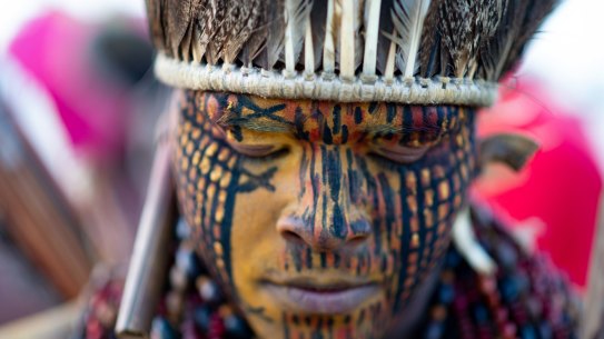 A member of an indigenous community joins a demonstration for indigenous land rights in Brasilia, Brazil, on Wednesday.  