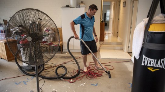 Jason Byrne dries out his flood damaged garage. 
