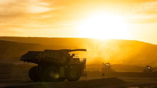Komatsu dump trucks carrying ore at Rio Tinto’s Oyu Tolgoi open-pit copper mine.