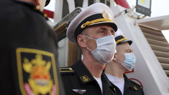 A Russian commander stands during a welcoming ceremony for a joint naval exercise with the Iranian navy and Iran’s Revolutionary Guard navy. 