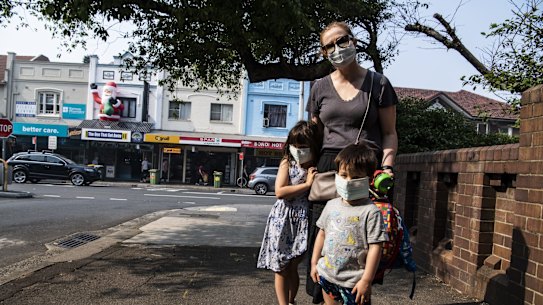 Emily with her two children Abigail and Alexander, walking along Bondi Road, Bondi on their way to school wearing face masks due to heavy smoke haze in Sydney. 21st November 2019 Photo Louise Kennerley
SMH