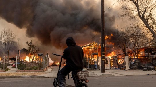 Structures burn during the Eaton Fire in Altadena, California, US, on Wednesday, Jan. 8, 2025. The most destructive wind storm to strike the Los Angeles area in 14 years is fanning wildfires and has sent thousands of residents fleeing for their lives, with dangerous gusts expected to persist for at least another two days. Photographer: Jill Connelly/Bloomberg
