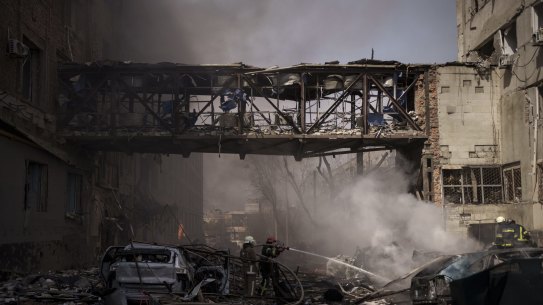 Firefighters work to extinguish multiple fires after a Russian attack in Kharkiv, Ukraine, on Saturday.