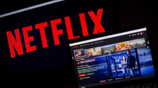 An Apple Inc. laptop displays the home screen for the Netflix Inc. original series 'The Mechanism' next to signage on a television monitor in an arranged photograph taken in Sao Paulo, Brazil, on Wednesday, March 28, 2018. While the world rebels against Facebook Inc., Netflix Inc. is stirring up controversy in Brazil. A #DeleteNetflix campaign has burst forth on Twitter since "The Mechanism," a show that is a work of fiction based on the real-life, multi-year corruption probe dubbed Carwash, was added to the streaming service Friday. Photographer: Rodrigo Capote/Bloomberg