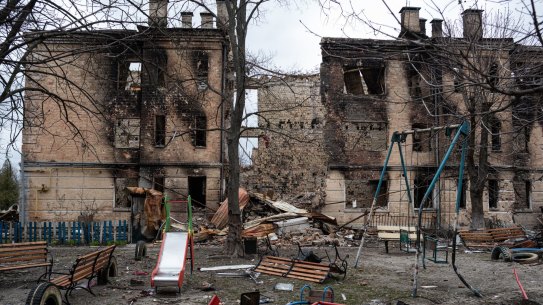 HOSTOMEL, UKRAINE - APRIL 06: A damaged playground is seen next to a heavily damaged apartment building on April 6, 2022 in Hostomel, Ukraine. Hostomel was occupied for more than a month by Russian forces as they pushed toward the Ukrainian capital, before ultimately retreating to Belarus last week. (Photo by Alexey Furman/Getty Images)