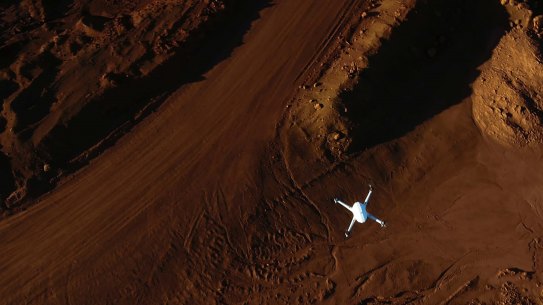 An Airobotics automated drone flies over a mine site. Drones over 250 grams will now face tougher enforcement.  