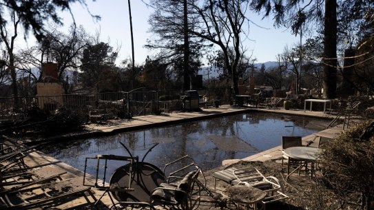 Debris around a pool in the aftermath of the Eaton fire in Altadena, California.