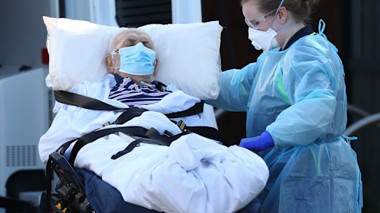 A resident is taken from the Epping Hardens Aged Care Home in July.