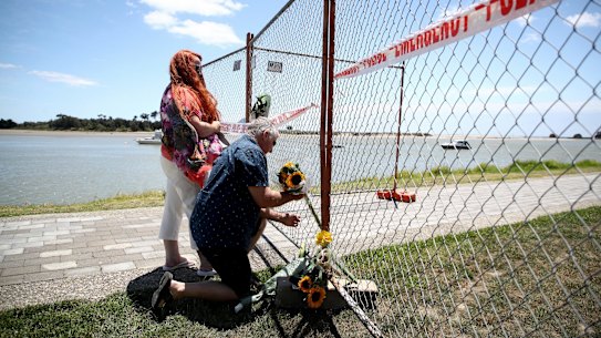 WHAKATANE, NEW ZEALAND - DECEMBER 10:  Floral tributes are placed on a fence at the Whakatane Wharf on December 10, 2019 in Whakatane, New Zealand. 5 people are confirmed dead and several are missing following the volcanic eruption at White Island on Monday. (Photo by Phil Walter/Getty Images)