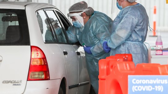 A nurse conducts a COVID-19 test at a drive-through facility in Geelong. 