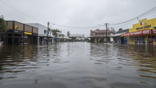 Byron Bay’s main street should be filled with tourists, but instead it is deserted as floodwaters have impacted the area.