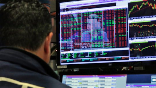 Federal Reserve Chair Janet Yellen's news conference in Washington is reflected on a specialist's screen on the floor of the New York Stock Exchange, Wednesday, Dec. 14, 2016. Stocks slipped Wednesday after the Federal Reserve raised interest rates on the back of a strengthening job market and increased its forecast for rate hikes next year. (AP Photo/Richard Drew)