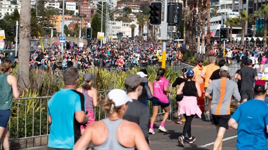 Runners arrive in Bondi for the conclusion of the City2Surf race.