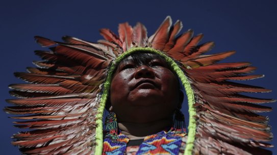 A female indigenous chief attends a march by indigenous women protesting the policies of Brazilian President Jair Bolsonaro in Brasilia this week.