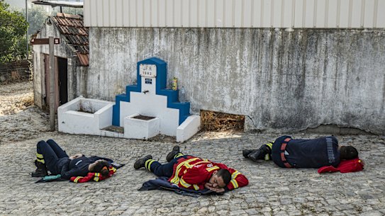 Firefighters are among the many types of essential we rely upon to work at all hours of the day. This photograph shows firefighters resting on the ground after spending the night battling wildfires in Portugal in 2022.
