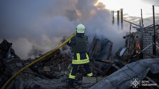 Firefighters put out flames following a Russian rocket attack in Odesa, Ukraine, on Sunday. 
