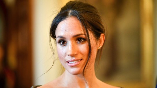 Meghan Markle speaks to people in the Drawing Room of Cardiff Castle in Cardiff, Wales, Thursday, Jan. 18, 2018. During their tour, Prince Harry and Ms. Markle will hear performances from musicians and poets, meet sportsmen and women, and see how organisations are working to promote Welsh language and cultural identity. (Ben Birchall/Pool Photo via AP)
