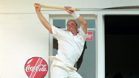 Warne celebrates on the Trent Bridge balcony after victory over England in the Fifth Test in 1997.