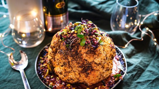 Slow-roasted spiced cauliflower with romesco and herbs. Vegetarian Christmas recipes for Good Food, November 2019. Images and recipes byÂ KatrinaÂ Meynink. Good Food use only.