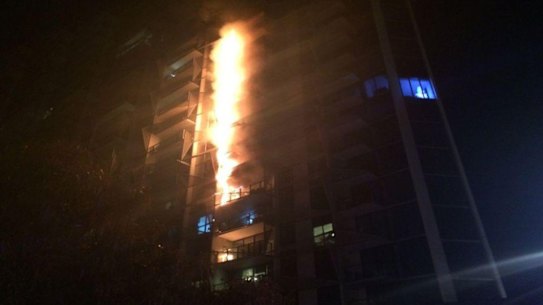 A fire caused by flammable cladding roars up the Lacrosse apartment building in Melbourne's Docklands.