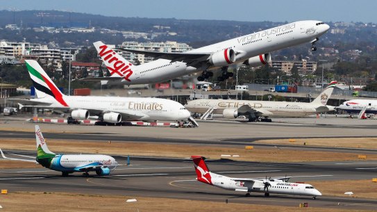 The Productivity Commission says the caps on plane movements every hour are 'unnecessarily restrictive'.