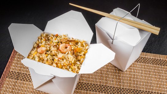 Chinese fried rice in a cardboard takeaway container.
Shutterstock image downloaded under the Good Food team account (contact syndication for reuse permissions).