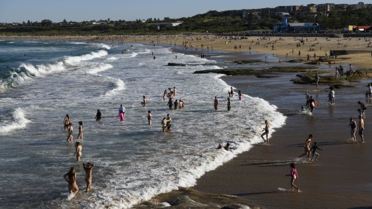 People flock to Sydney beaches as the temperature hits 28 degrees on Saturday. 