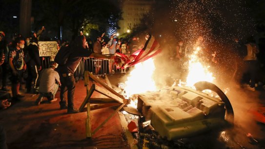 Demonstrators near the White House in Washington start a fire as they protest in the aftermath of the death of George Floyd. Floyd died after being restrained by Minneapolis police officers.