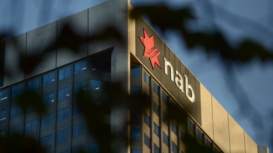The National Australia Bank Ltd. (NAB) logo is displayed atop a building in Melbourne, Australia, on Friday, May 1, 2015. NAB is scheduled to report interim results on May 7. Photographer: Carla Gottgens/Bloomberg
