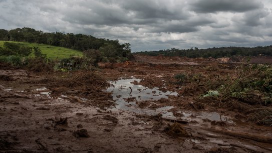 Water and mud from the failed tailings dam at Brumadinho in Brazil. The collapse of another Vale tailings dam and the impact of Cyclone Veronica on the Pilbara miners have removed 100 million tonnes of iron ore from the market this year.