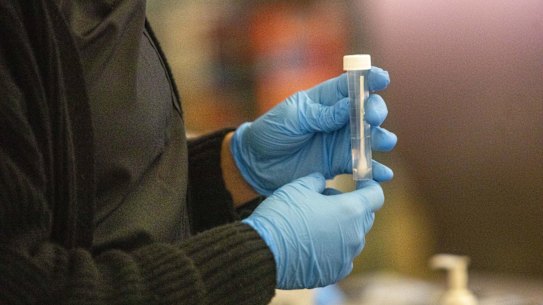 A test swab at a CDC COVID-19 variant testing site inside the airport in Los Angeles.