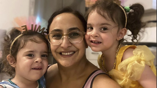 Sharon Aloni Cunio, centre, and her twin daughters, Emma and Yuli, 3 years-old, were released on Monday, local time.