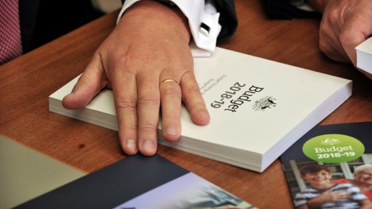 Scott Morrison with the 2018-19 budget that contained the 7-year tax plan that ends on July 1 with the start of the stage 3 tax cuts.