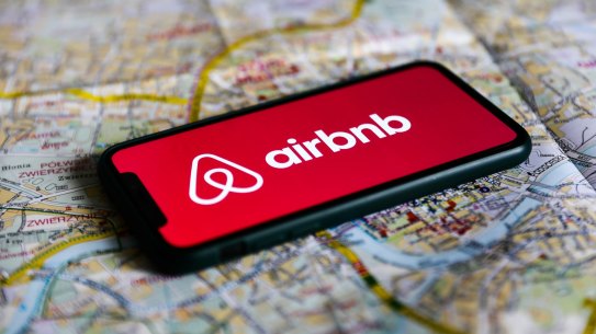 Airbnb logo displayed on a phone screen and a map of Krakow are seen in this illustration photo taken in Krakow, Poland on August 17, 2021. (Photo by Jakub Porzycki/NurPhoto via Getty Images) Getty image for Traveller. Single use only.