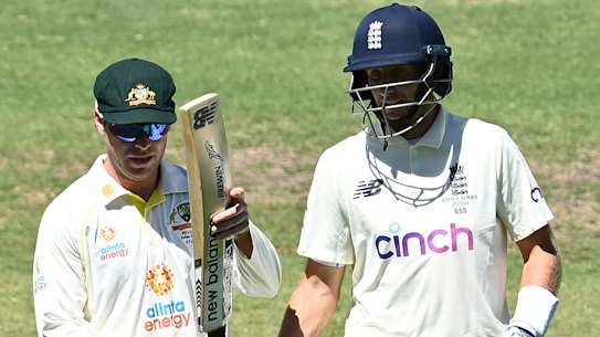 Marcus Harris inspects Joe Root’s bat in Adelaide during the second Test.