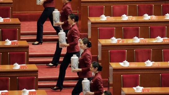 Attendants serve tea ahead of the opening of the 19th National Congress of the Communist Party of China at the Great Hall of the People in Beijing, China, on Wednesday, Oct. 18 2017. Chinese President?Xi Jinping warned of ?severe? challenges, as he kicked off a twice-a-decade party meeting that may signal if he will appoint a successor to rule after 2022. Photographer: Qilai Shen/Bloomberg