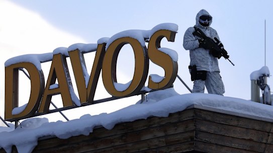 An armed member of the Swiss Police watches from the roof of the Hotel Davos ahead of the World Economic Forum (WEF) in Davos, Switzerland.
