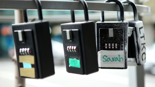 Lock boxes for short-term rentals on Spencer Street.