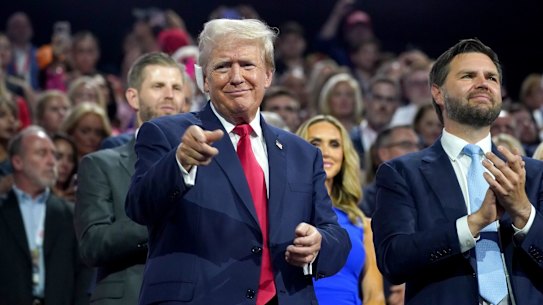 Former US President Donald Trump, left, and Senator JD Vance, a Republican from Ohio and Republican vice-presidential nominee, during the Republican National Convention (RNC) at the Fiserv Forum in Milwaukee, Wisconsin, US, on Monday, July 15, 2024. Former President Donald Trump tapped JD Vance as his running mate, elevating to the Republican presidential ticket a venture capitalist-turned-senator whose embrace of populist politics garnered national attention and made him a rising star in the party. Photographer: Al Drago/Bloomberg