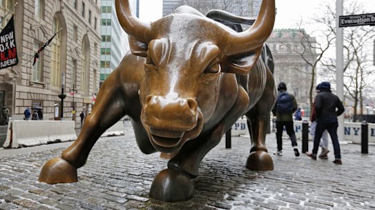 FILE - This Wednesday, Feb. 7, 2018 file photo show the Charging Bull sculpture by Arturo Di Modica, in New York's Financial District.  The U.S. stock market is poised this week to pass a surprising milestone, rising for the longest, unbroken stretch of time in the history of U.S. stock trading. If stocks donât drop significantly in the next three days, the bull market that began in March 2009 will have lasted nine years, five months and 13 days. Itâs a record that few would have predicted when the stocks finally found their footing after a 50 percent plunge during the financial crisis. (AP Photo/Richard Drew, File)