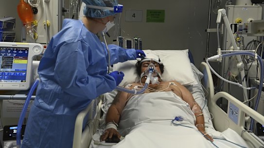 ICU Registered Nurse Shaunagh Whelan (left) cares for a COVID-19 positive patient in St Vincentâs Hospitalâs ICU. Sydney, NSW. 13th July, 2021. Photo: Kate Geraghty