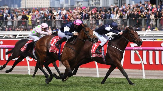 Rekindling ridden by jockey Corey Brown (centre) during their win at the 2017 Melbourne Cup at Flemington Racecourse.
