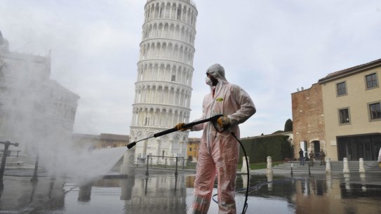 A worker carries out coronavirus sanitation operations in Pisa in 2020. The pandemic has created new opportunities for Italy’s organised crime.