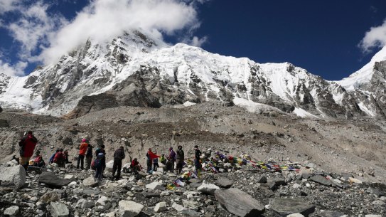 FILE - In this Sept. 27, 2015 file photo, trekkers rest at Everest Base Camp, Nepal. A South African climber was in police custody in Nepal's capital Wednesday after he attempted to scale Mount Everest without obtaining the mandatory permit, an official said. Ryan Sean Davy from Johannesburg had been caught by a mountaineering official at the Everest base camp earlier this month and his passport was seized. He agreed to trek down the mountain and surrender to the Tourism Department in Kathmandu, where he was detained on Tuesday. (AP Photo/Tashi Sherpa, File)